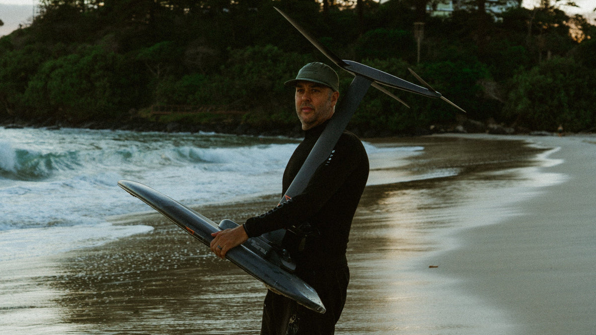 Follow founder Steve Anderson heading out for a seesion on his Foil Drive in the Follow P1 Oceana Wetty Top and Follow Welded Boardie in Black
