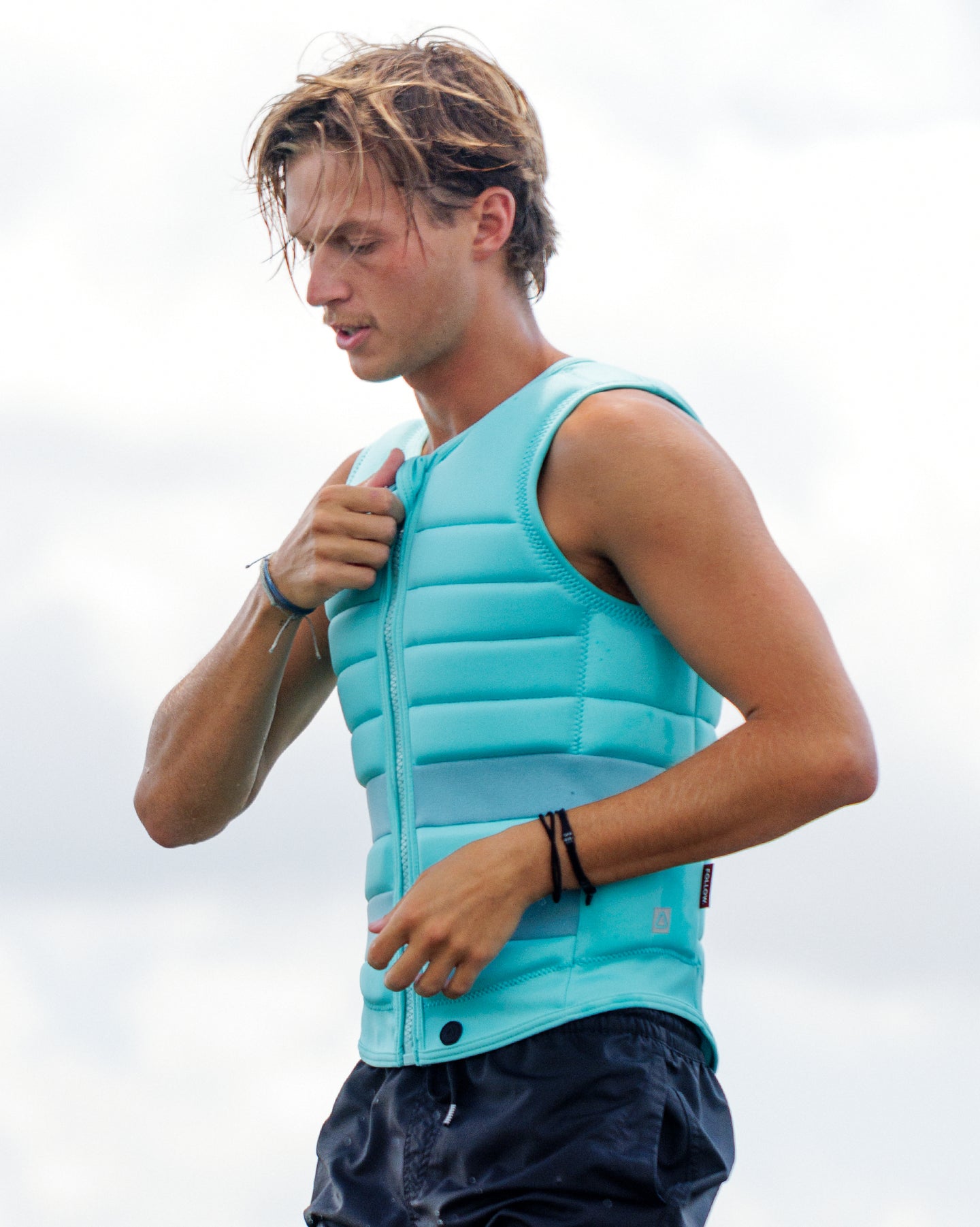 Follow Asset Impact Vest - Teal Lifestyle 2